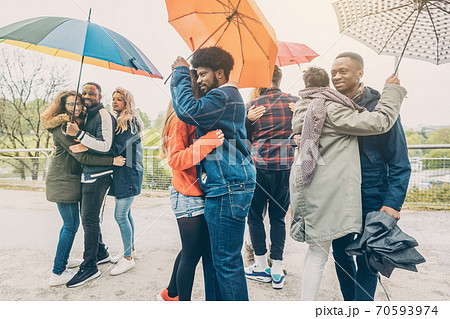 Dancers in the park in rainy weather 70593974