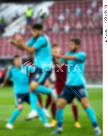 blurred background of soccer players during football game blurred background of soccer players during football game 70594048
