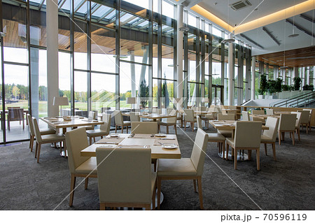 Group of tables served for guests of luxurious restaurant inside business center 70596119