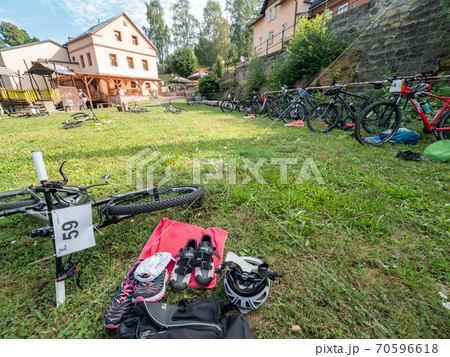 Lots of mountainbikes laying in the grass Lots of mountainbikes laying in the grass 70596618