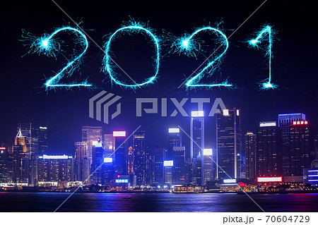 2021 Happy New Year fireworks over Hong Kong cityscape at night 70604729