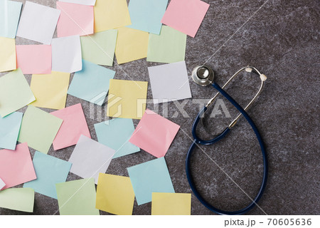 many blank paper stick note list with doctor stethoscope many blank paper stick note list with doctor stethoscope 70605636