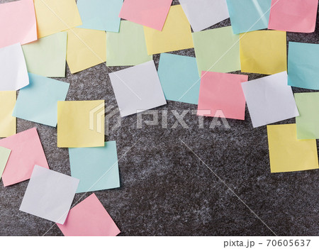 multicolored paper stick note list on concrete wall 70605637