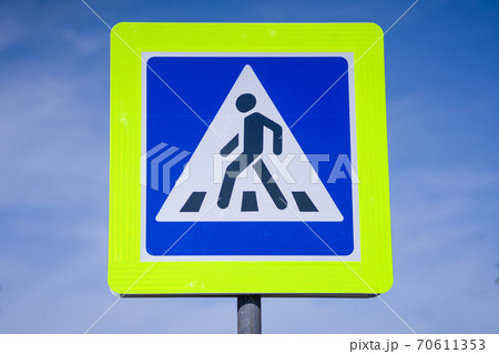 Zebra crossing, pedestrian cross warning traffic sign in blue and pole Zebra crossing, pedestrian cross warning traffic sign in blue and pole 70611353