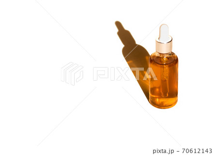 Glass bottle and dropper OIL on white isolated background. 70612143