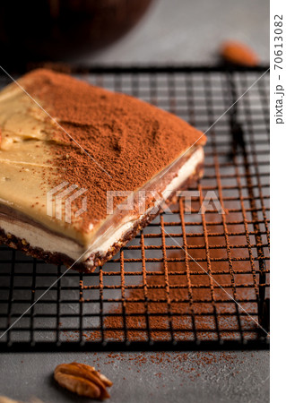 No bake eco-friendly pecan cake on metal mesh tray 70613082
