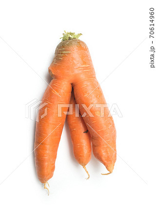 Closeup of strange carrot on white background 70614960