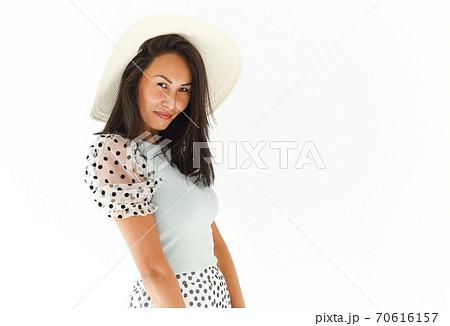 Charming ethnic woman in summer outfit Charming ethnic woman in summer outfit 70616157