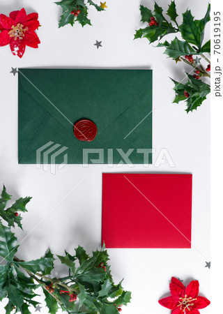 Christmas mock-up letter, envelope and holly leaves frame. 70619195