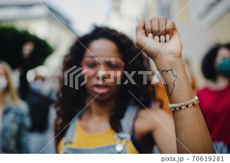 African american woman activists protesting on streets, strike and demonstration concept. 70619281