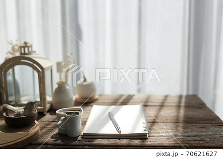 Coffee heart cup Interior house vintage decor and plants pot on wooden table with see through curtain Coffee heart cup Interior house vintage decor and plants pot on wooden table with see through curtain 70621627