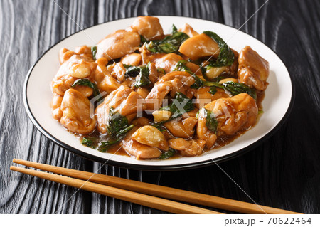 Three Cup Chicken, is a classic Taiwanese dish made by cooking chicken with sesame oil, soy sauce and rice wine close-up in a plate. horizontal Three Cup Chicken, is a classic Taiwanese dish made by cooking chicken with sesame oil, soy sauce and rice wine close-up in a plate. horizontal 70622464
