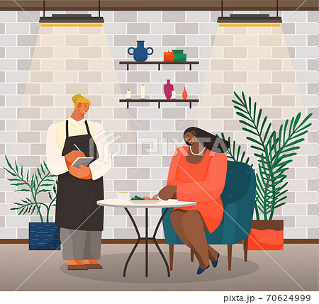 Woman sitting at a table eating salad, girl waitress standing with a sheet of paper writes order Woman sitting at a table eating salad, girl waitress standing with a sheet of paper writes order 70624999