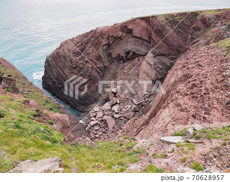 Cobblers Hole, St Anns Head, folds in the Sandstone rock, Pembrokeshire, Wales 70628957