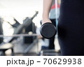 Close-Up on Woman Hand Holding Dumbell 70629938