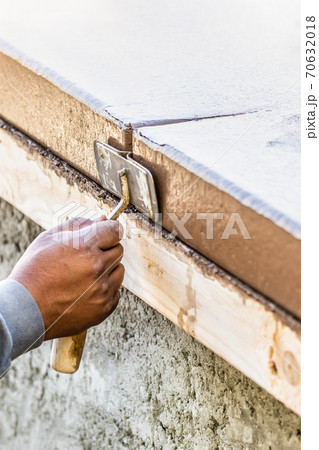 Construction Worker Using Hand Groover On Wet Cement Forming Coping Around New Pool 70632018