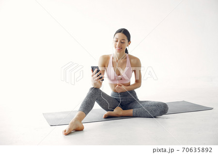 A beautiful girl is engaged in a yoga studio 70635892