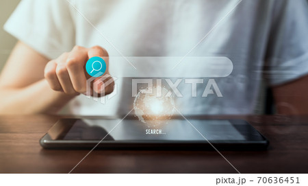 Woman using digital tablet and searching browsing Internet button on virtual on screen mobile. Woman using digital tablet and searching browsing Internet button on virtual on screen mobile. 70636451