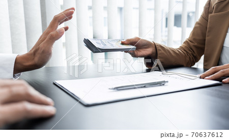 Businessman partner hand gesture rejecting refusing money, anticorruption concept. 70637612