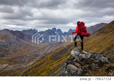 Woman Backpacking on Scenic Rocky Hiking Trail 70637728