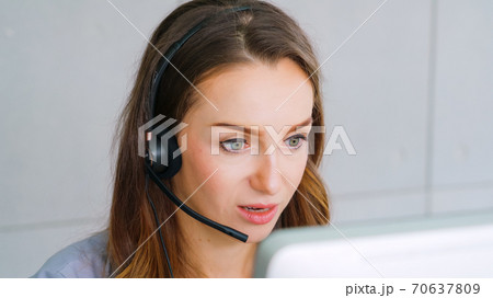 Business people wearing headset working in office 70637809