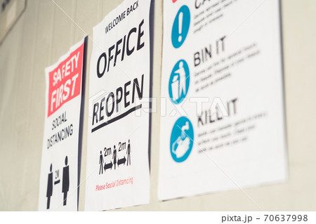 Sign caution in factory warning to industry labor worker to prevent Covid-19 70637998