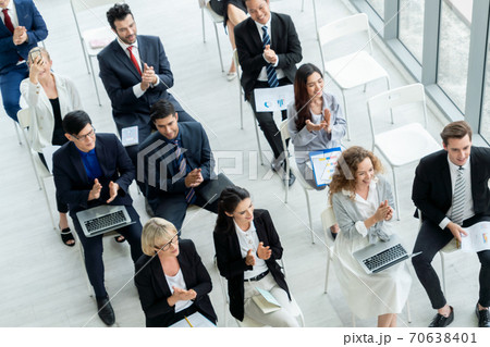 Group of business people meeting in a seminar conference Group of business people meeting in a seminar conference 70638401