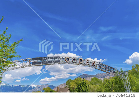 Welcome arch at the city of Ogden Utah against vivid blue sky and puffy clouds 70641219