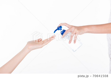 woman hand held Sanitizer dispenser Alcohol 70% Gel pump bottle 70641508