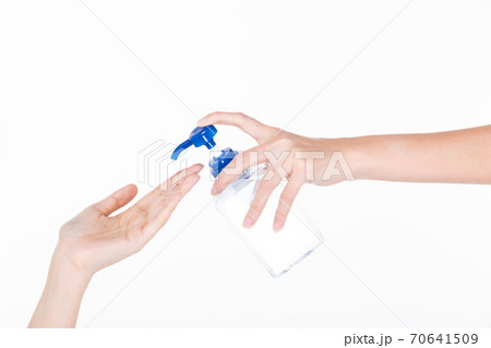 woman hand held Sanitizer dispenser Alcohol 70% Gel pump bottle 70641509