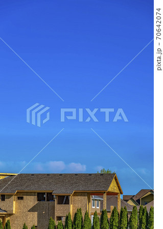 Exterior of a house under construction with blue sky background on a sunny day Exterior of a house under construction with blue sky background on a sunny day 70642074