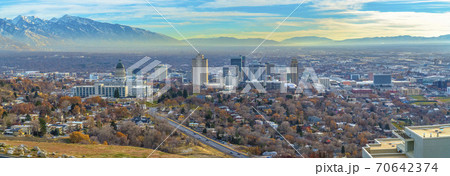 Utah State Capital Building and skyscrapers towering over the populous city Utah State Capital Building and skyscrapers towering over the populous city 70642374