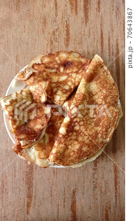 Fried pancakes on old wooden table. Shot. Top view Fried pancakes on old wooden table. Shot. Top view 70643867