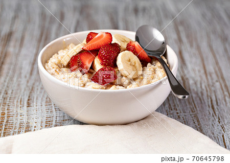 prepared oatmeal with fruits and berries prepared oatmeal with fruits and berries 70645798