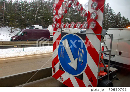 Highway emergency security warning sign on a highway announcing danger. 70650791