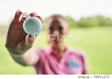 Caucasian golfer in a polo shirt standing outdoors Caucasian golfer in a polo shirt standing outdoors 70651275