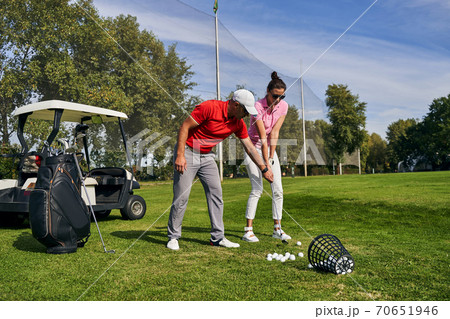 Woman getting ready to strike the ball 70651946