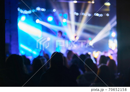 people having fun in a disco. blur effect for an artistic touch 70652158