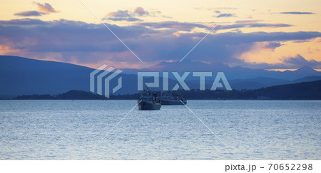 fishing ships at sunset in the Avacha Bay on the Kamchatka Peninsula fishing ships at sunset in the Avacha Bay on the Kamchatka Peninsula 70652298