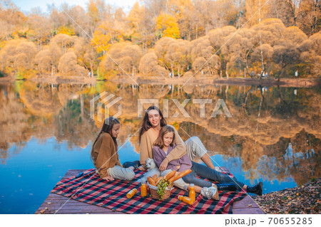 Happy family on a picnic in the park at autumn 70655285