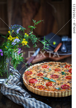 Delicious homemade quiche lorraine with chicken, tomato, mushrooms and cheese Delicious homemade quiche lorraine with chicken, tomato, mushrooms and cheese 70658221