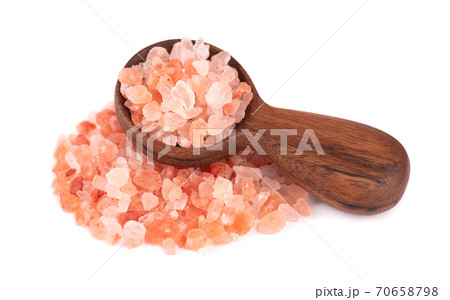 Himalayan pink salt in wooden spoon, isolated on white background. Himalayan pink salt in crystals. Himalayan pink salt in wooden spoon, isolated on white background. Himalayan pink salt in crystals. 70658798