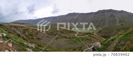 Bitlis, Turkey - 21 May 2011: Panorama of Nemrut crater lake. Panoramic view of the volcano Nemrut. Beautiful blue mountain lake. Bitlis, Turkey - 21 May 2011: Panorama of Nemrut crater lake. Panoramic view of the volcano Nemrut. Beautiful blue mountain lake. 70659402