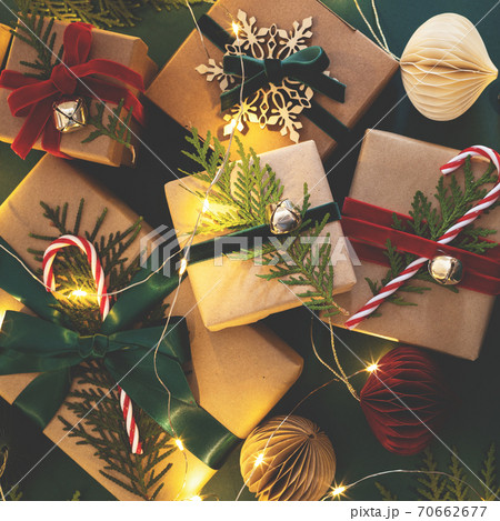 Christmas gift boxes with garland. Christmas gift boxes with garland. 70662677