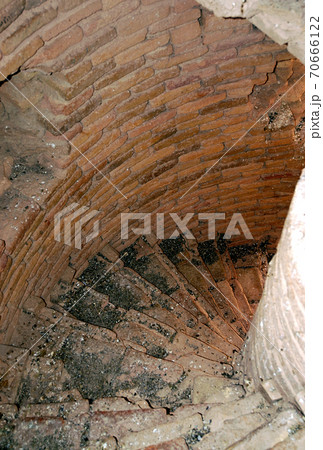 Minaret of Jam, Ghor Province in Afghanistan. The Jam minaret is a UNESCO site in a remote part of Central Afghanistan. The top of the Minaret of Jam showing the spiral staircase and inner brickwork. 70666122