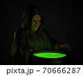 Halloween witch stirring in green poison soup in her cauldron 70666287