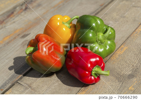 Fresh colorful bell pepper box on wooden table. Top view 70666290