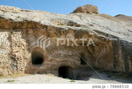Takht-e Rostam (Takht-e Rustam) is a stupa monastery in northern Afghanistan. Entrance to the cave monastery with rooms inside. Takht e Rostam is between Mazar i Sharif and Pol e Khomri, Afghanistan. Takht-e Rostam (Takht-e Rustam) is a stupa monastery in northern Afghanistan. Entrance to the cave monastery with rooms inside. Takht e Rostam is between Mazar i Sharif and Pol e Khomri, Afghanistan. 70666510