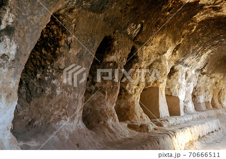 Takht-e Rostam (Takht-e Rustam) is a stupa monastery in northern Afghanistan. Inside the cave monastery showing the cave system. Takht e Rostam is between Mazar i Sharif and Pol e Khomri, Afghanistan. Takht-e Rostam (Takht-e Rustam) is a stupa monastery in northern Afghanistan. Inside the cave monastery showing the cave system. Takht e Rostam is between Mazar i Sharif and Pol e Khomri, Afghanistan. 70666511