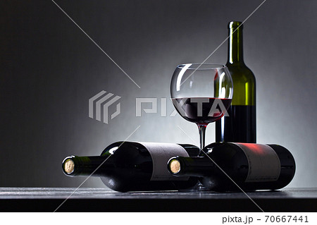 Bottles of red wine . 70667441